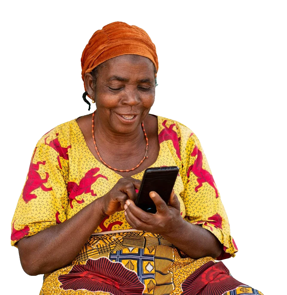 A smiling woman in a yellow and red printed dress types a message on her phone.